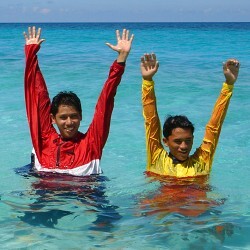 Lifeguard signals both hands up danger