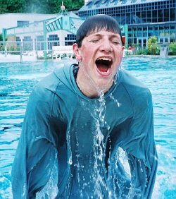 power training in pool with red anorak